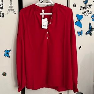 Beautiful red long sleeve blouse, perfect for any occasion.